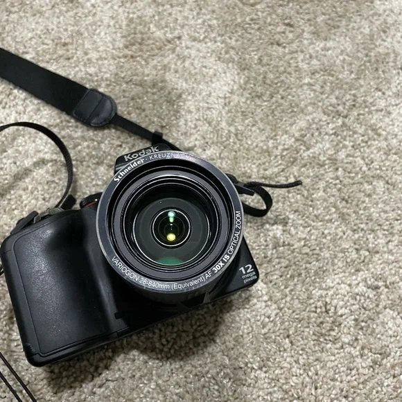 Black Kodak camera with accessories